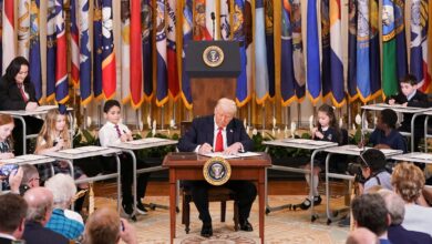 Trump signs order gutting Department of Education while surrounded by kids