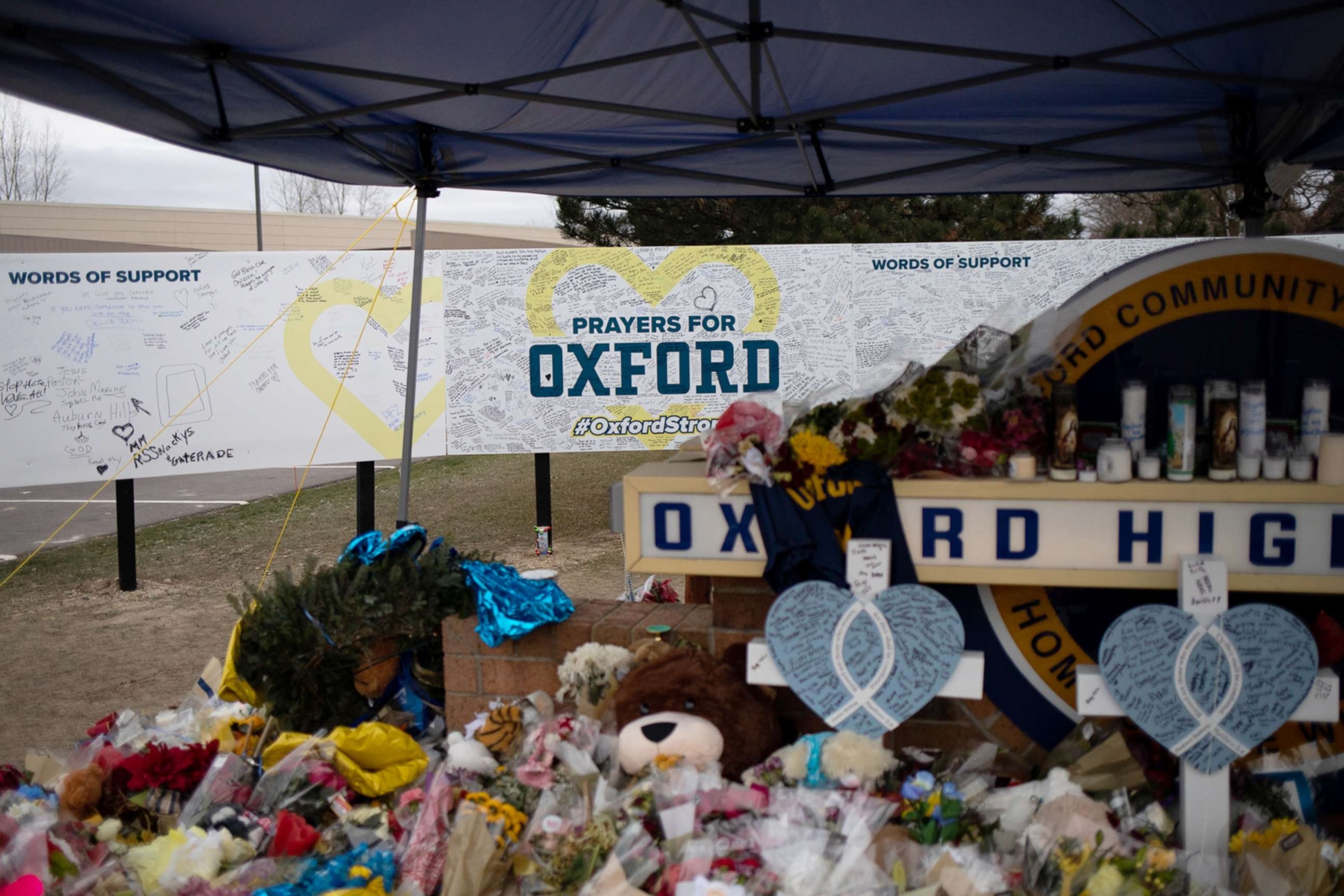 PHOTO: A board where community members can share words of support alongside the memorial outside of Oxford High School, where four students were killed and seven others injured on Nov. 30, 2021, Dec. 7, 2021 in Oxford, Mich.