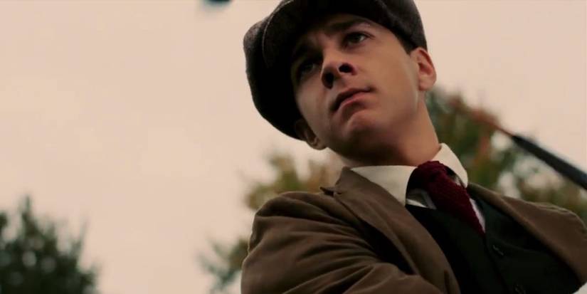 Shia LaBeouf as Francis Ouimet golfing and looking at the golf ball with expectations in The Greatest Game Ever Played